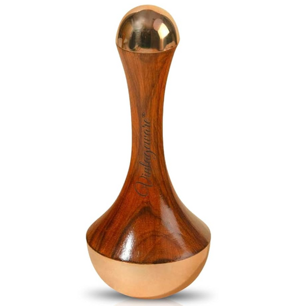 An Ayurvedic Dual Kansa Wand with a wooden handle and dual metal ends for face and body massage.